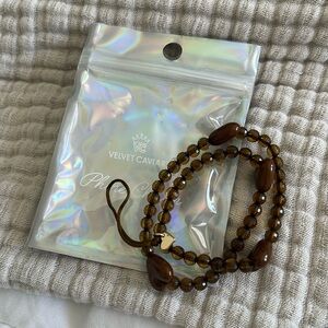 Velvet caviar brown phone charm new